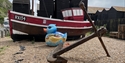 giant blue painted rubber duck by fishing boat at rock a nore hastings