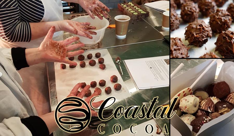 photograph of hands rolling chocolate truffles