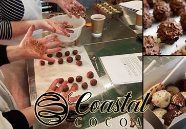 photograph of hands preparing chocolate truffles