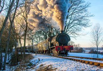 steam engine from front, in snowy landscape.