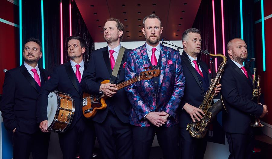 group photograph of The Horne Section's Hit Show