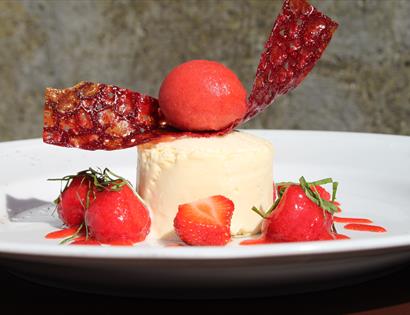 dessert dish with strawberries.