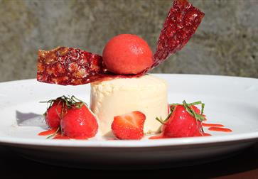 dessert dish with strawberries.