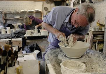 artists producing pottery in workshop at JCJ Pottery