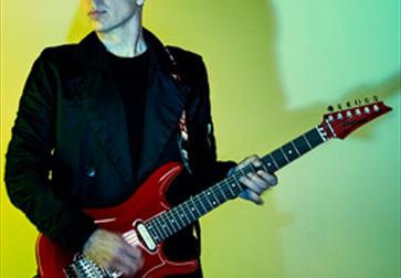 Joe Satriani plays Guitar  - poster