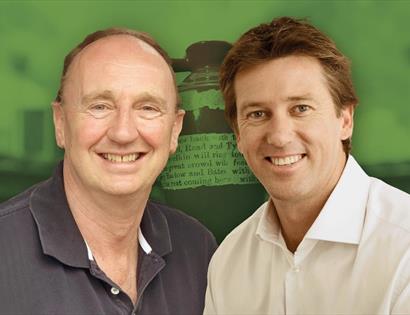 photograph of two white men against a green background.