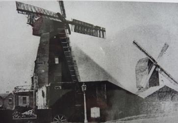 Black and white photo of windmills