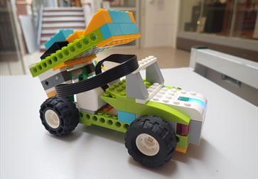 Lego vehicle on a table.