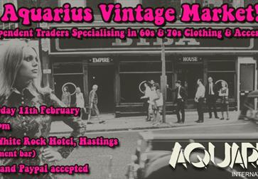 poster with black and white photograph showing sixties highstreet and model Twiggy. Text overlaying is bright pink, text as in description.