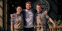 three Pizza Express Hastings staff members standing outside the restaurant