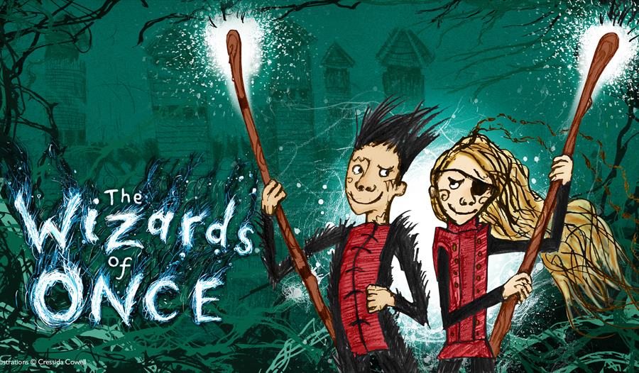 a green illustrated poster. To the left says 'The Wizards of Once'. To the right are character illustrations of boy and girl holding staffs. Girl has