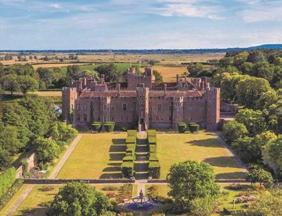 aerial view of Herstmonceux Castle and formal grounds
