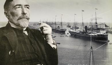 Black and white photo of Joseph Conrad in front of the docks