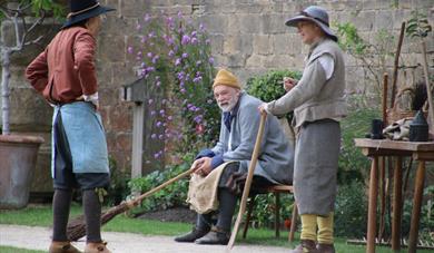 A trio of costumed performers, ready for an event at Ford Green Hall