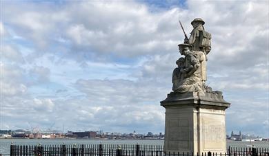 The war memorial on the New Brighton promenade, looking out over the River Mersey with Liverpool in the background