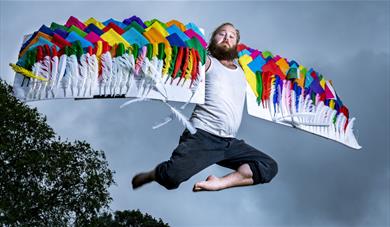 Man flying with quilted wings