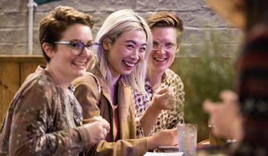 Three people laughing