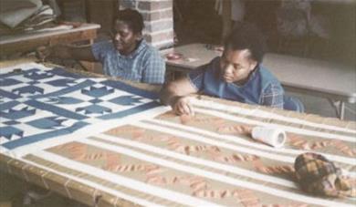 Women making quilts