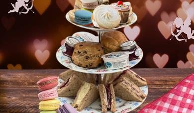 tea tray with sandwiches, scones, and sweets
