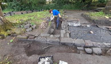 A volunteer excavates at Bidston Community Archaeology event.