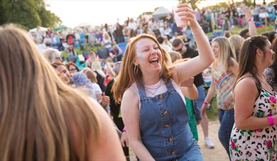 A visitor enjoys great live music at one of The Trentham Estate's Summer Concerts