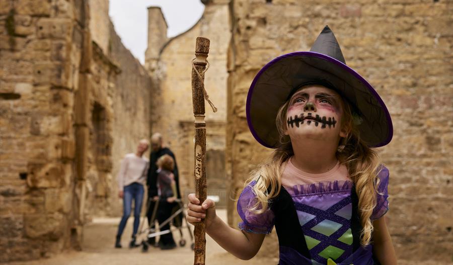 Photo of a young child dressed like a witch at Bolsover Castle