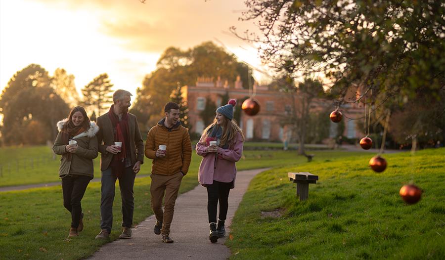 a group of people walking the grounds at Killertin National Trust