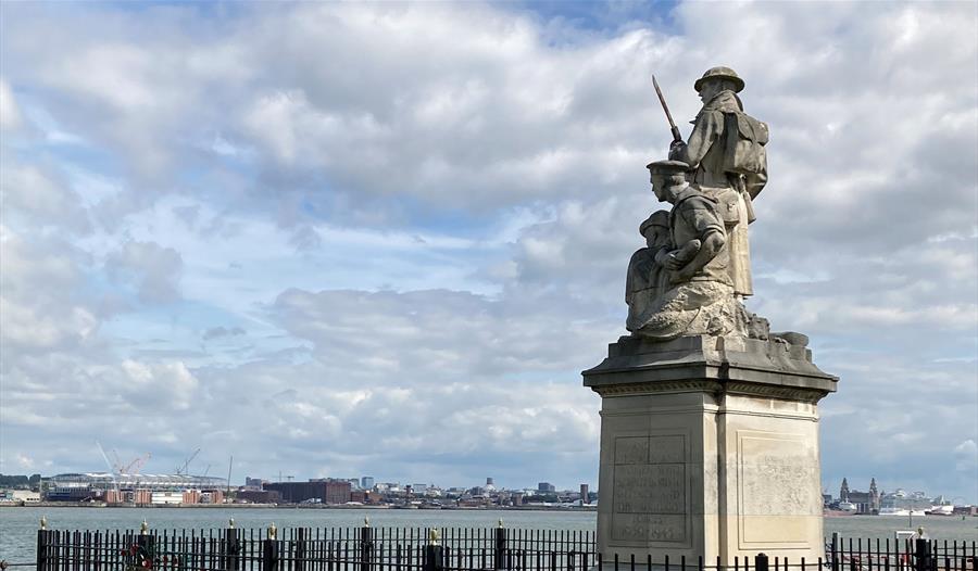 The war memorial on the New Brighton promenade, looking out over the River Mersey with Liverpool in the background