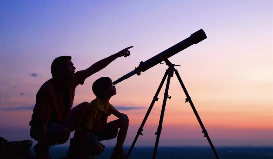 couple using telescope