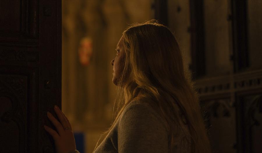 A woman peering out of one the Cathedral’s secret spaces that are rarely open to the general public.