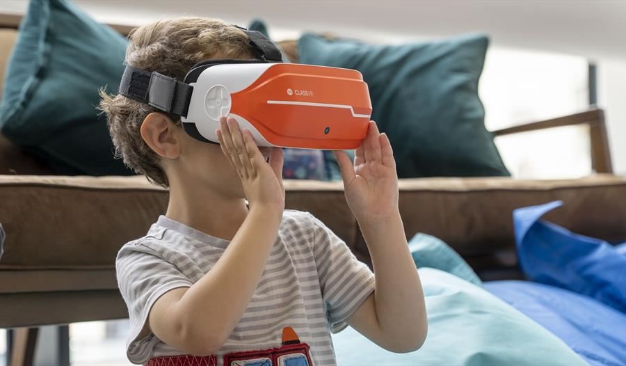 the boy wearing his VR headset