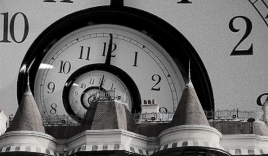 the russell-cotes in front of a clock face