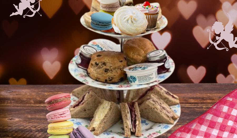 tea tray with sandwiches, scones, and sweets