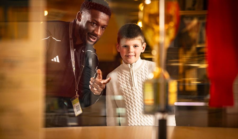 Image of a kid and footballer