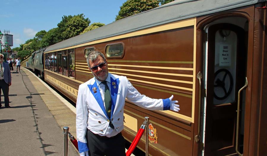 Andrew P.M. Wright next to 'Devon Belle' Observation Car