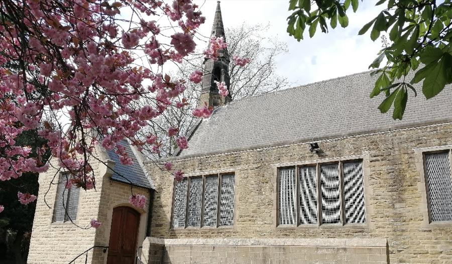Newbold Parish Church with a blossom tree