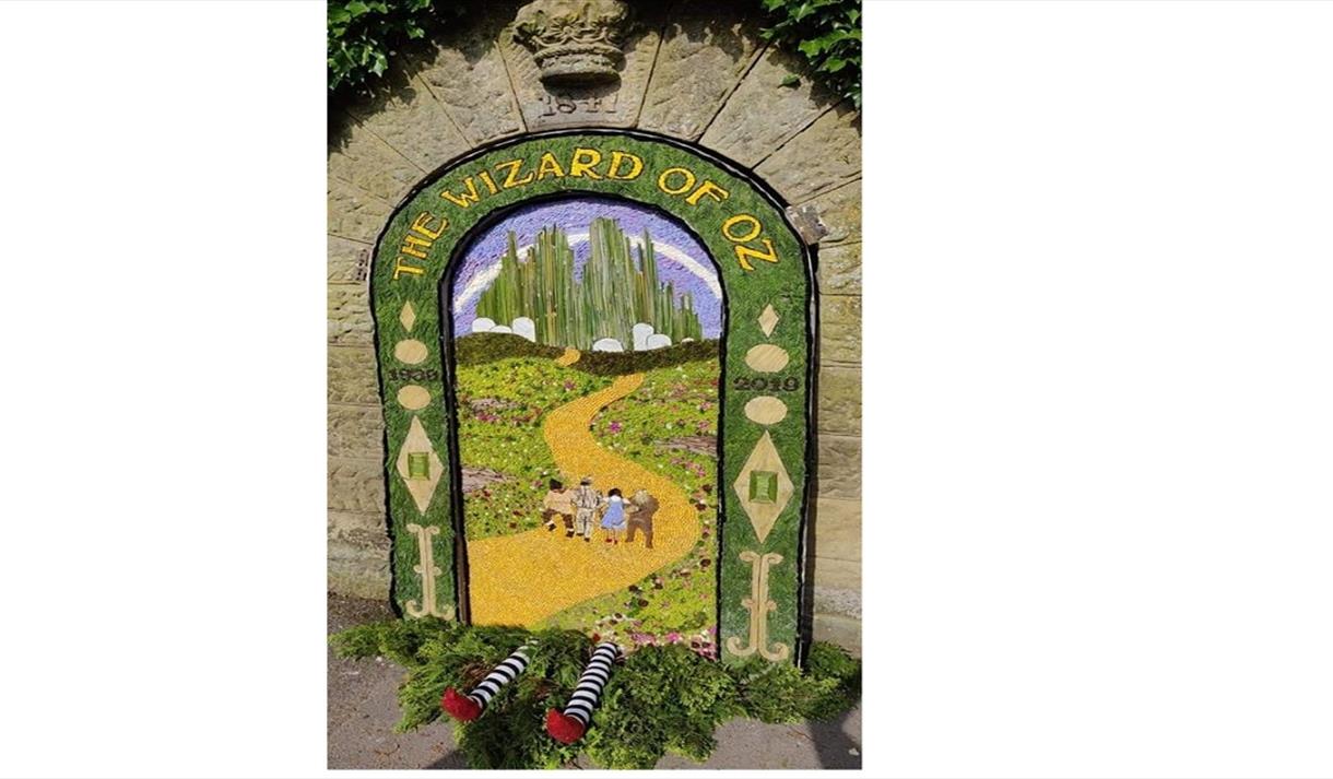 Rowsley Well Dressing from 2019 depicting The Wizard of Oz with Wicked Witch's legs sticking out the bottom
