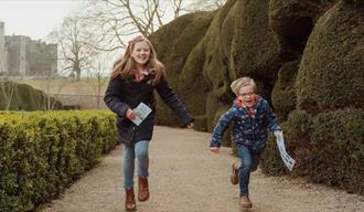 Two children running in Raby Gardens