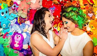 two-brides-in-front-of-colourful-teddies