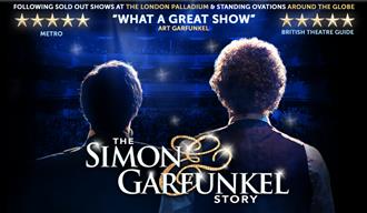 Two men face a theatre of people, their backs towards the camera.