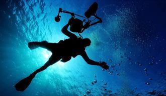 a diver under the surface of the ocean