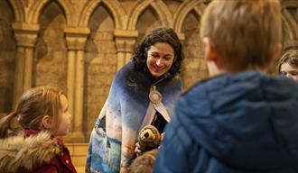 Elizabeth Baker, local storyteller and writer, entertaining children at Durham Cathedral with thought-provoking tales.