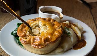 Pie, mash ad gravy on plate, Browns Pie Shop, Lincoln.