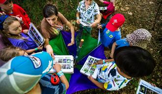 children being read a story outside