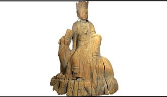 A wooden carving of the Buddhist figure of Guanyin