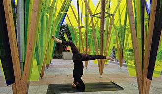 jules doing a headstand on yoga mat
