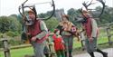 Image shows horn dancers on their traditional procession through Abbots Bromley