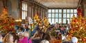 image of christmas market indoors with christmas trees