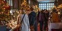 image of christmas market indoors with christmas trees