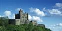 Bolsover Castle on the hilltop against a dramatic sky